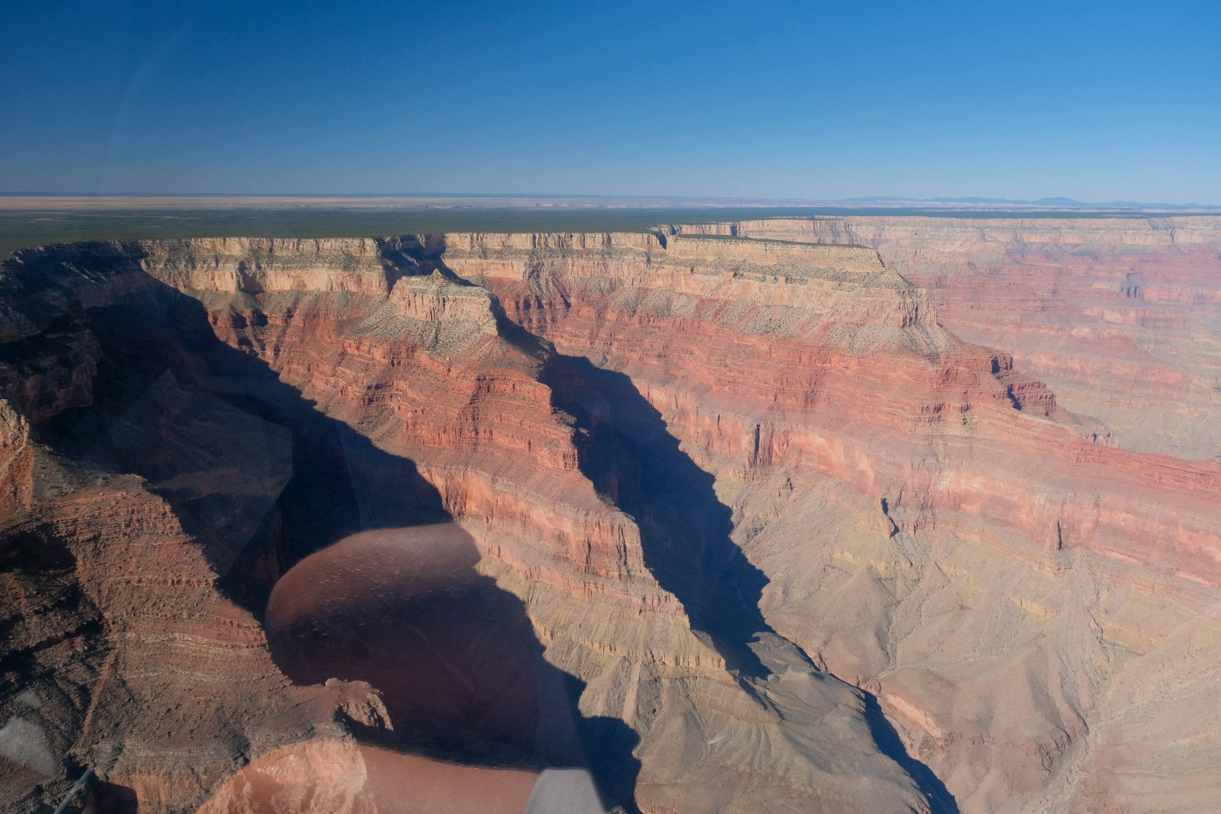 Foto Grand Canyon met weerspiegeling van het glas in helikopter