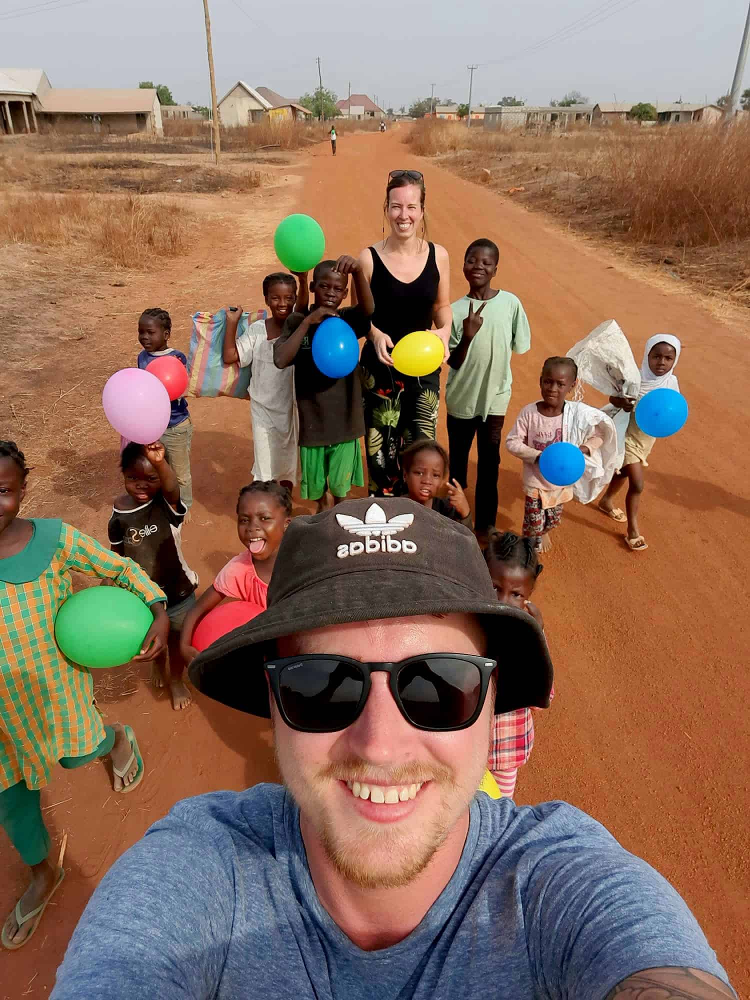 Handing out balloons to children in Tamale, Ghana.